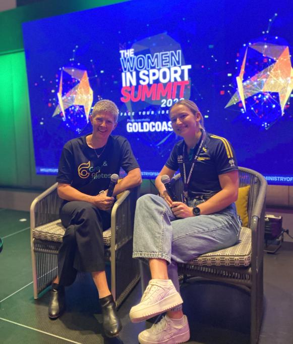 Natalie Cook and fellow athlete sitting on the stage at The Women In Sport Summit Gold Coast 2023